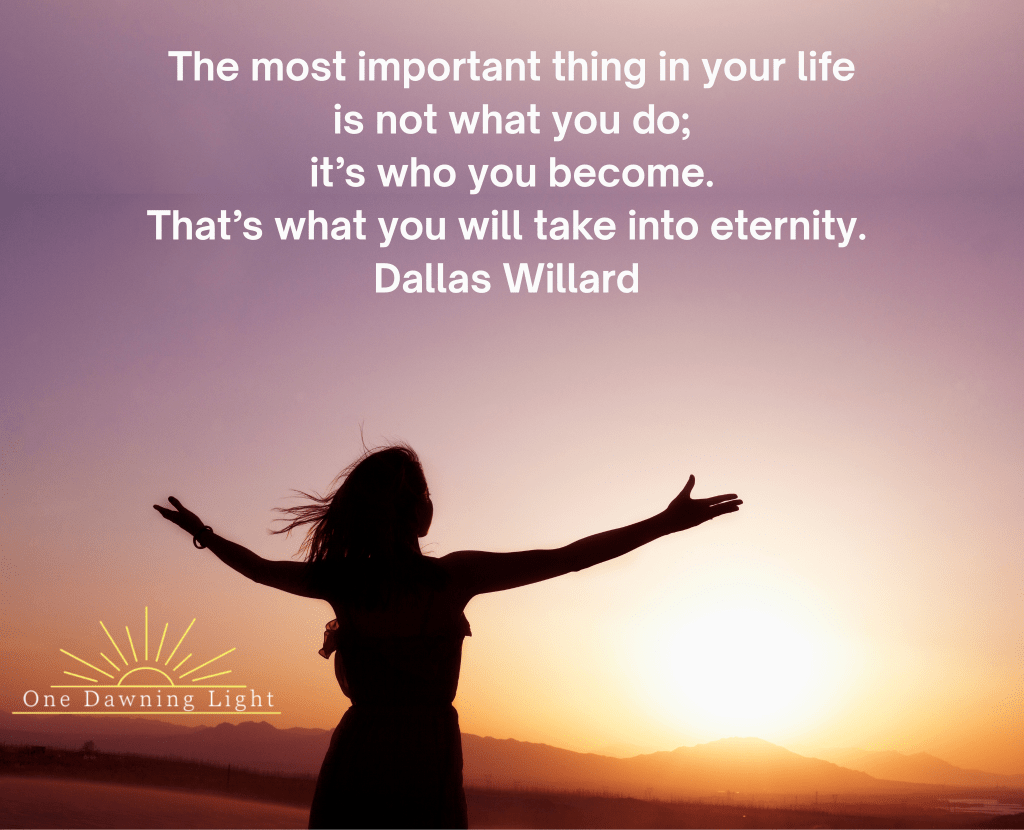 Female silhouette handing arms out with a sunrise