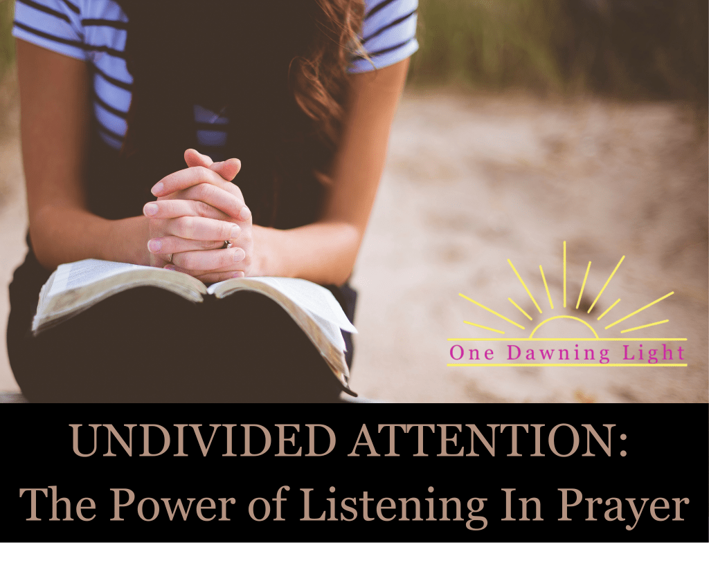 Woman praying over bible outside